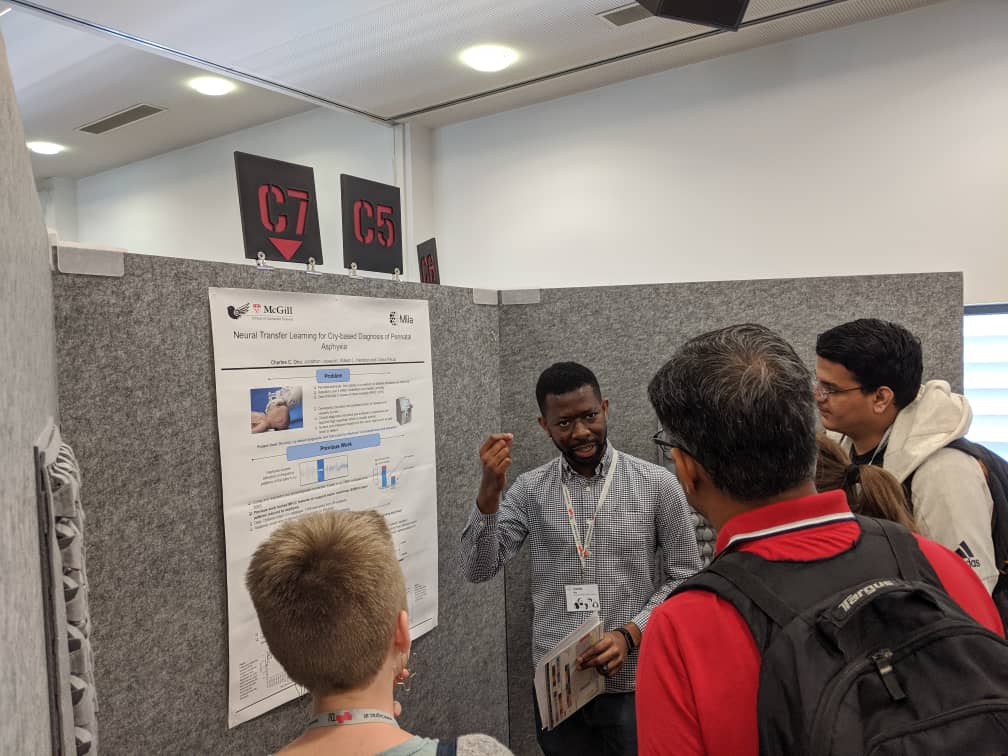 Charles delivering a poster presentation at INTERSPEECH 2019 in Graz, Austria.